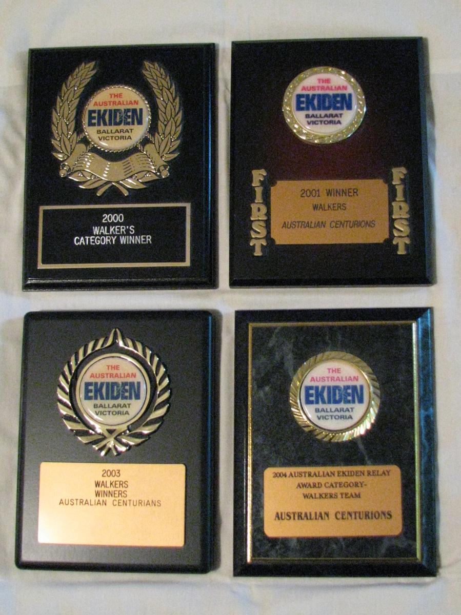 Our 4 winning plaques from the Ballarat Ekiden Relay
For a number of years, the Australian Centurions entered a team in the Ballarat Ekiden Relay which was contested around Lake Wendouree in Ballarat. We were lucky enough to win the walk division on 4 occasions - 2000, 2001, 2003 and 2004 - and these winners' plaques were awarded to us. 

